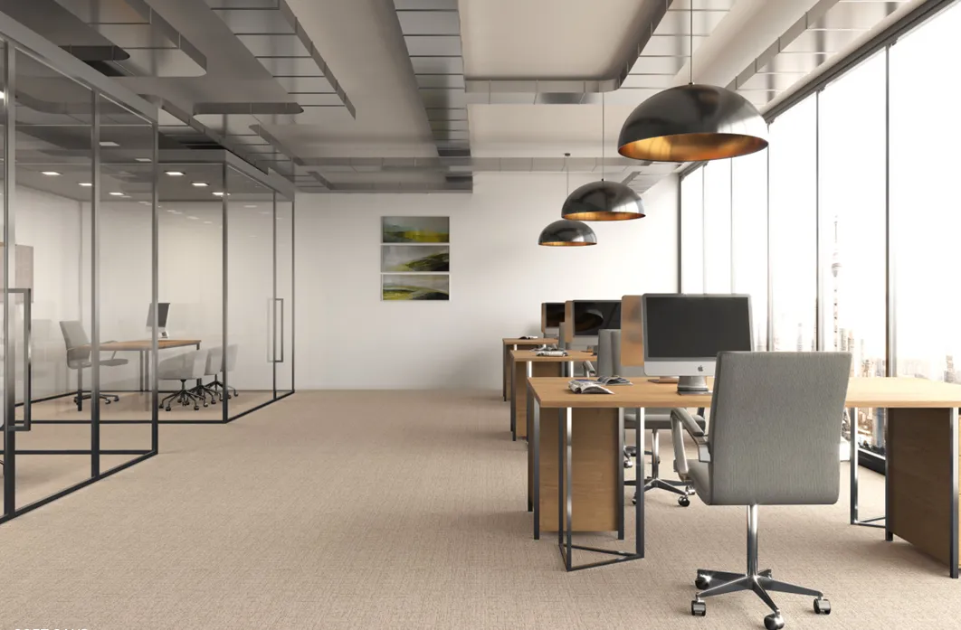 Open plan office with beige carpet tiles under the desks